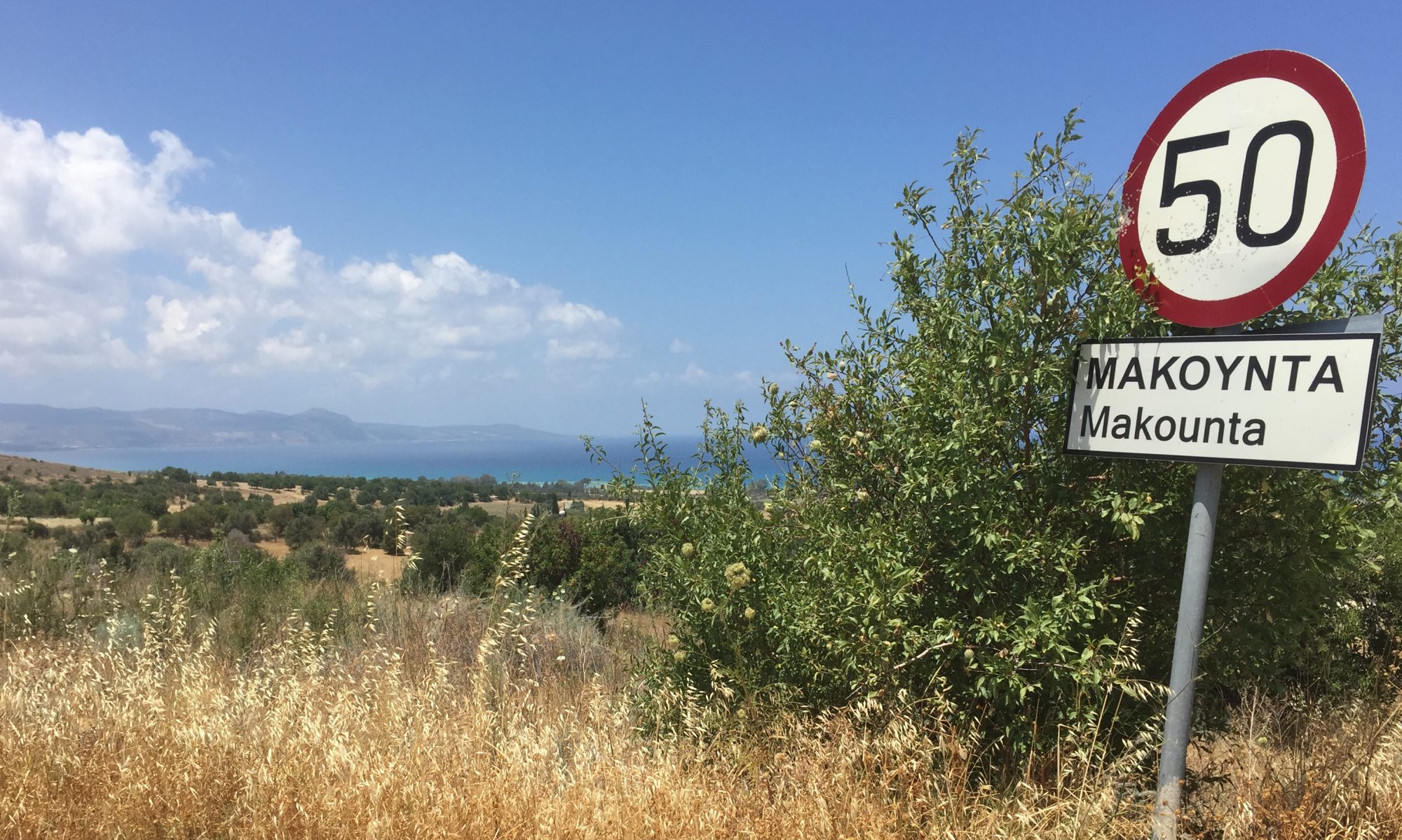 Landscape in Cyprus with a 50 km speed limit sign indicating Makounta